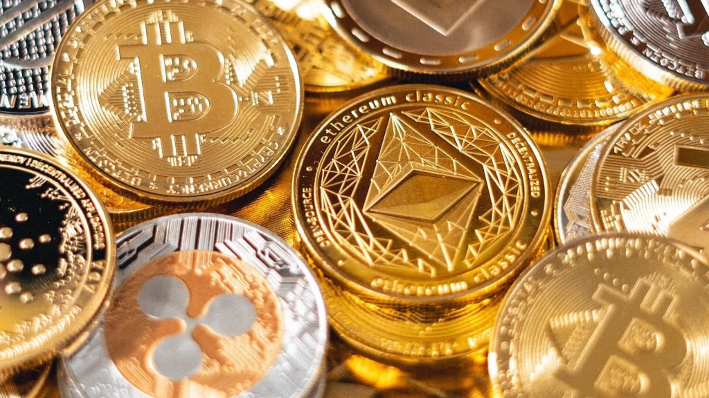 Image of several physical cryptocurrency coins representing different cryptocurrencies.